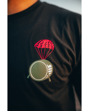 DROP DRUMS NOT BOMBS TEE