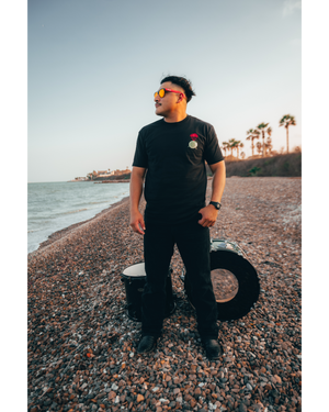 DROP DRUMS NOT BOMBS TEE