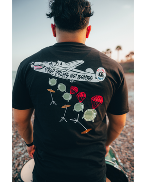 DROP DRUMS NOT BOMBS TEE