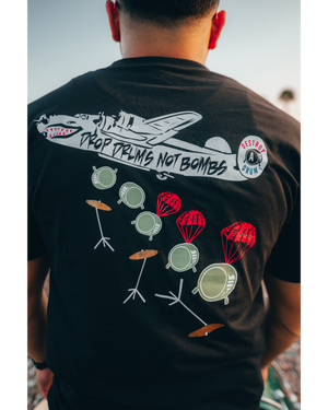 DROP DRUMS NOT BOMBS TEE