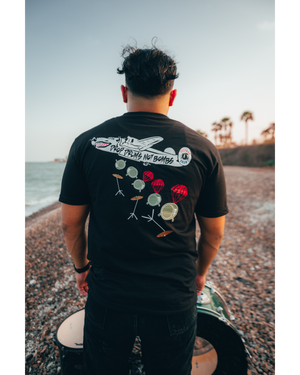 DROP DRUMS NOT BOMBS TEE